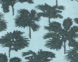 Palm tree patterned fabric in dark green on light blue background. Maison Mermont.