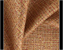 Woven textured fabric in earthy tones, ideal for home upholstery and decor. Maison Mermont.