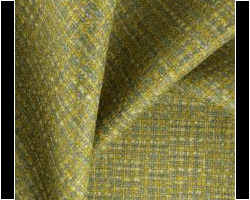 Textured green and yellow woven fabric for upholstery, showcasing detailed craftsmanship. Maison Mermont.