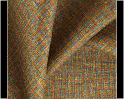 Colorful textured fabric for home decor, showcasing vibrant interwoven patterns. Maison Mermont.
