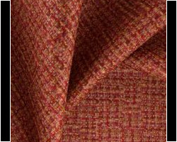 Rustic red and gold woven upholstery fabric with a textured pattern. Maison Mermont.