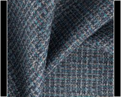 Textured blue and gray woven fabric for upholstery, showcasing intricate patterns. Maison Mermont.