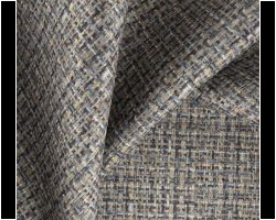 Tweed-patterned upholstery fabric in earthy tones. Ideal for stylish home decor. Maison Mermont.