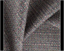 Textured upholstery fabric with multicolored woven pattern, ideal for home decor. Maison Mermont.