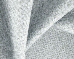 Elegant textured fabric with a subtle white and gray pattern, ideal for home décor. Maison Mermont.