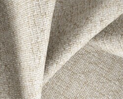 Beige woven textured fabric for upholstery and home decor elegance. Maison Mermont.