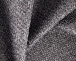 Gray woven fabric texture, ideal for upholstery or drapery. Maison Mermont.