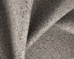 Textured gray woven fabric, ideal for upholstery and home decor. Maison Mermont.