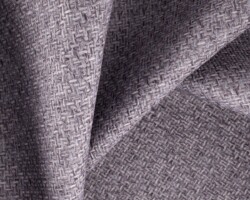 Gray woven fabric texture for upholstery, close-up detail. Maison Mermont.