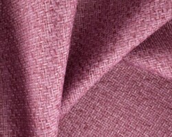 Woven pink textile fabric with a subtle texture, ideal for home decor. Maison Mermont.