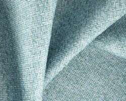 Light teal woven fabric with a subtle textured pattern, perfect for elegant home decor. Maison Mermont.
