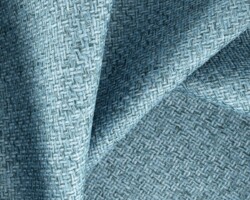 Blue textured woven fabric for home decor, offering a sophisticated look. Maison Mermont.