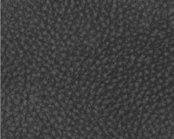 Close-up of textured dark fabric used in home furnishings. Maison Mermont.