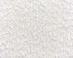 Bouclé Close-up of a textured white boucle fabric for upholstery. Maison Mermont.