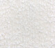 Bouclé Close-up of a textured white boucle fabric for upholstery. Maison Mermont.