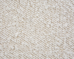 Cream textured boucle fabric detail, ideal for upholstery projects. Maison Mermont.
