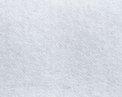 Elegant beige textured fabric for upholstery projects. Maison Mermont.