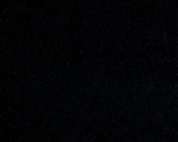 Luxurious black velvet fabric texture, ideal for elegant home decor. Maison Mermont.