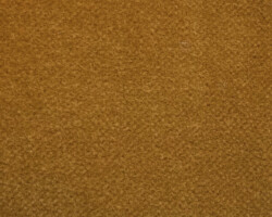 Close-up of textured mustard-colored fabric for home décor. Maison Mermont.
