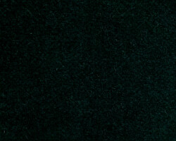 Luxurious dark green velvet fabric texture for home decor accents. Maison Mermont.