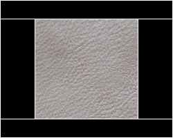 Close-up of beige textured fabric used in home furnishings. Maison Mermont.