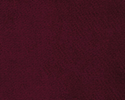 Luxurious burgundy textured fabric, ideal for upholstery or curtains. Maison Mermont.