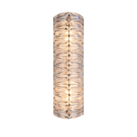 Elegant cylindrical glass wall sconce with brass accents, providing a warm glow. Perfect for modern decor. Maison Mermont.