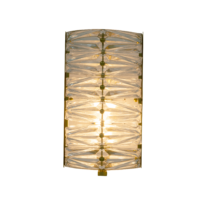 Elegant wall sconce with a textured glass shade and gold accents, perfect for stylish illumination. Maison Mermont.