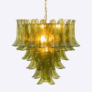 Elegant green glass chandelier with layered design, perfect for stylish home decor. Maison Mermont.