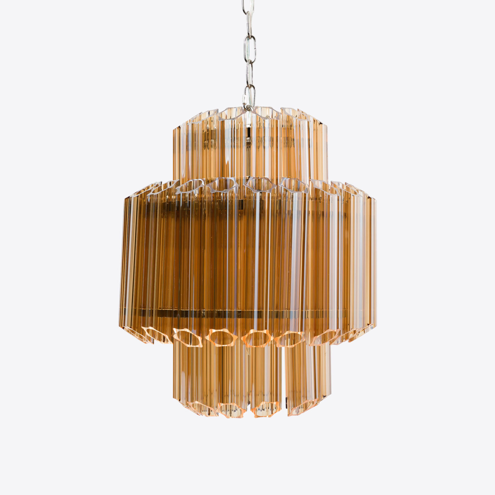Amber-Small-Celesta-Chandelier Elegant amber glass chandelier with layered design, ideal for modern interiors. Maison Mermont.