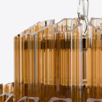 Amber-Small-Celesta-Chandelier Luxurious amber glass chandelier detail with elegant vertical lines. Maison Mermont.