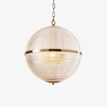 Elegant glass globe pendant light with gold accents, perfect for modern home decor. Maison Mermont.