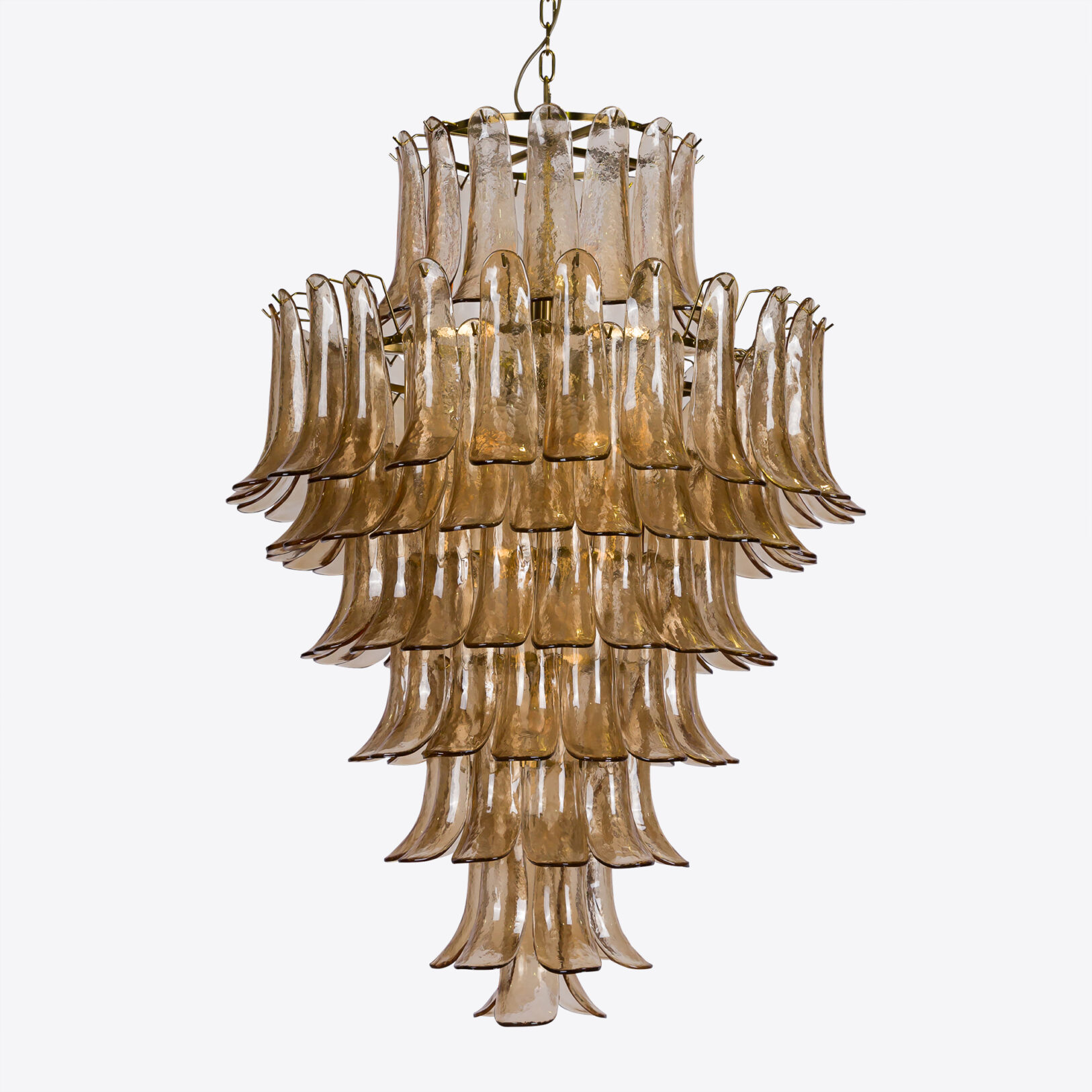 Amber Corolla Large Chandelier Elegant glass chandelier with layered, curved design, ideal for modern and sophisticated interiors. Maison Mermont.