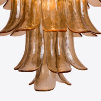Amber Corolla Large Chandelier Elegant amber glass chandelier featuring flowing, curved petals for a stunning focal point. Maison Mermont.