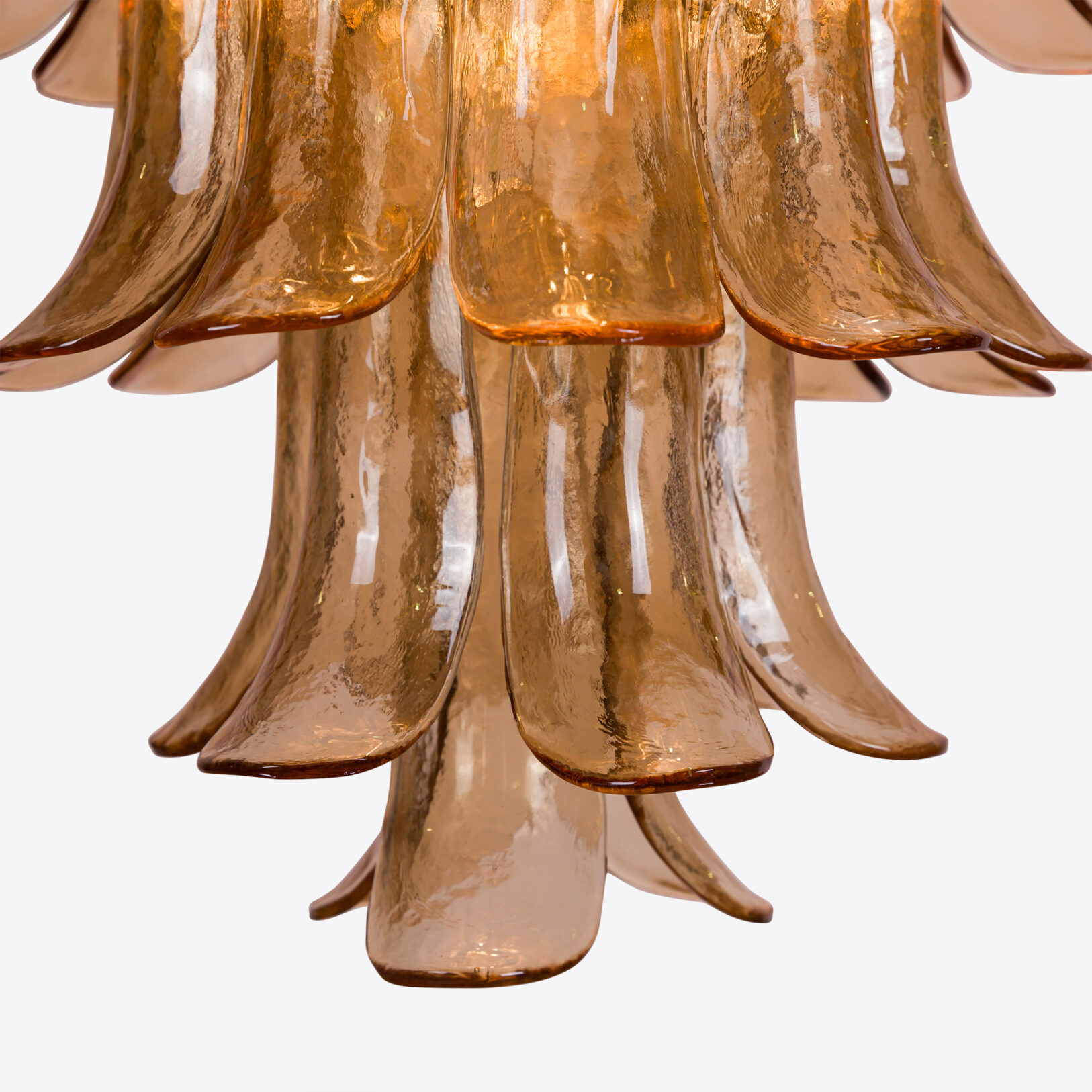 Amber Corolla Large Chandelier Elegant amber glass chandelier featuring flowing, curved petals for a stunning focal point. Maison Mermont.