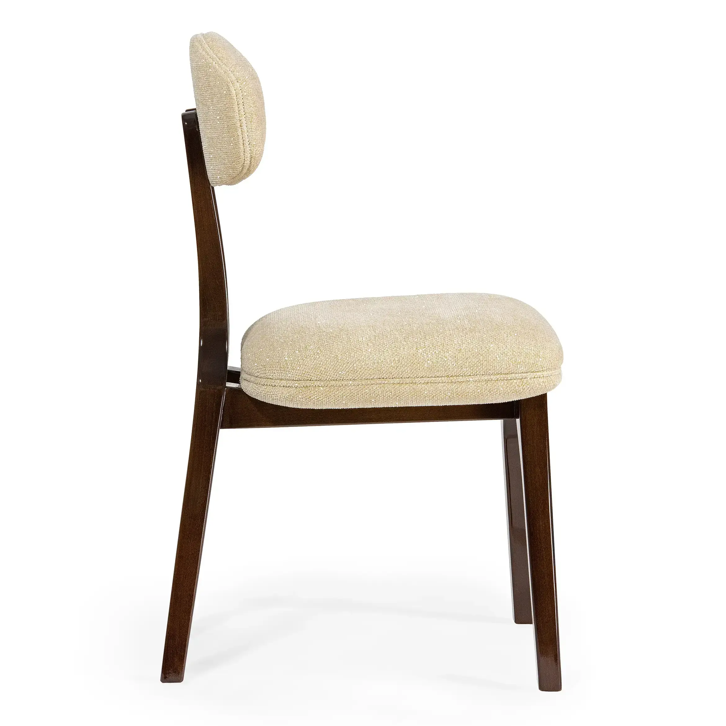 maison-mermont-silhouette-dining-chair-darli-01-translucent-dark-brown-03 Elegant side view of a modern upholstered chair with a soft beige fabric seat and dark wooden legs. Maison Mermont.