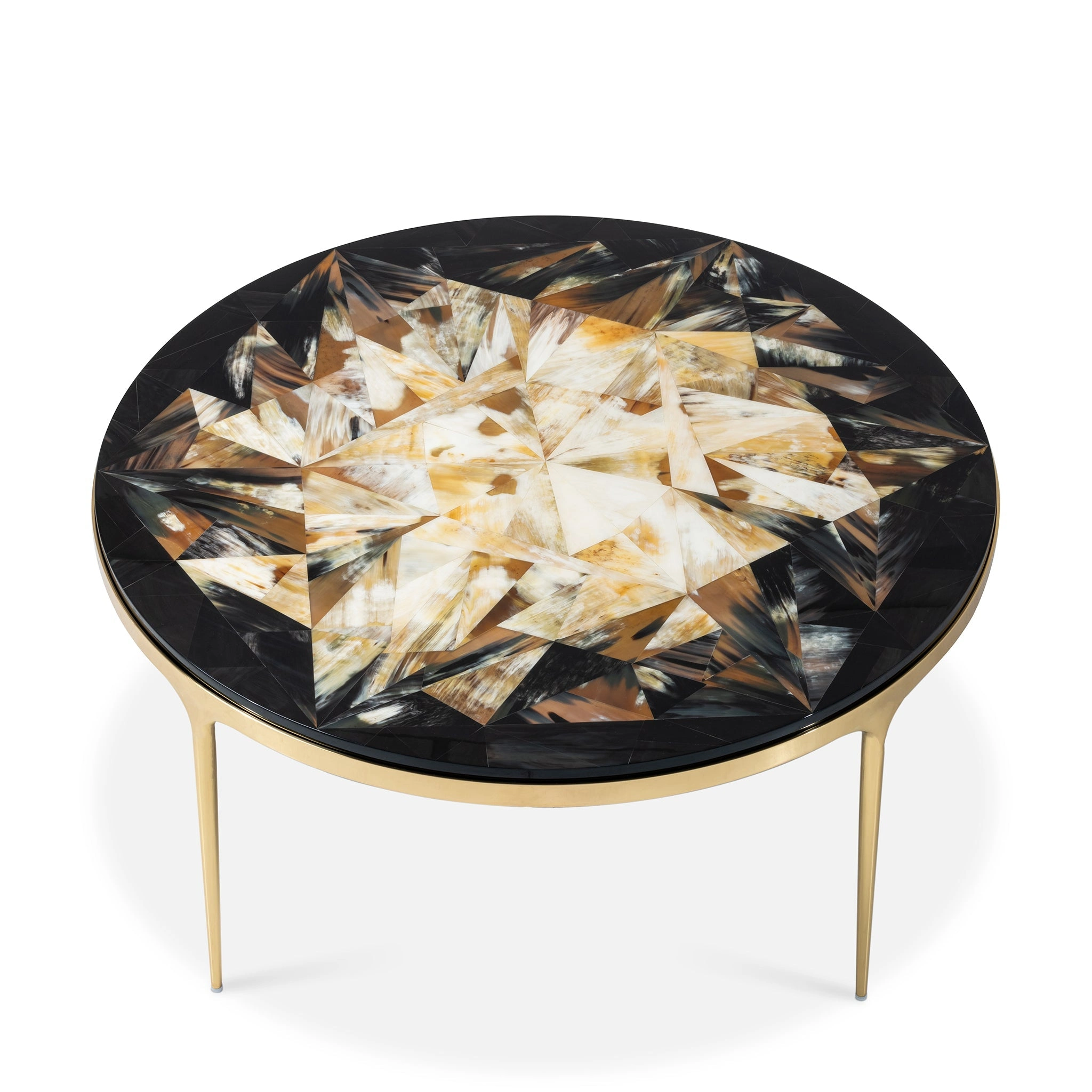 Elegant round coffee table with a geometric inlay design in earthy tones and sleek gold legs. Maison Mermont.
