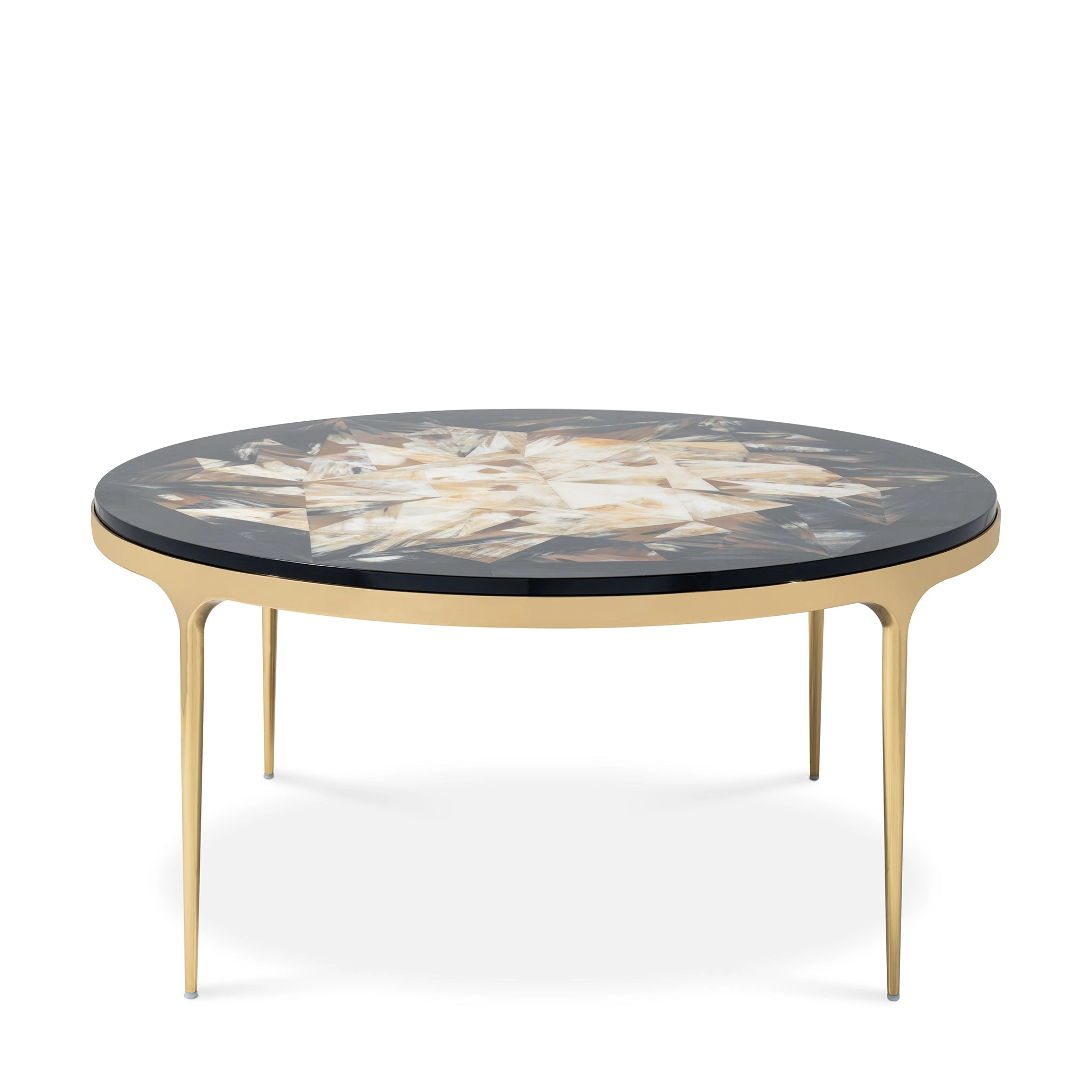 Elegant round coffee table with a unique inlaid top and gold legs, perfect for modern living spaces. Maison Mermont.