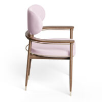 Elegant upholstered chair with wooden frame and gold accents, perfect for stylish interiors. Maison Mermont.