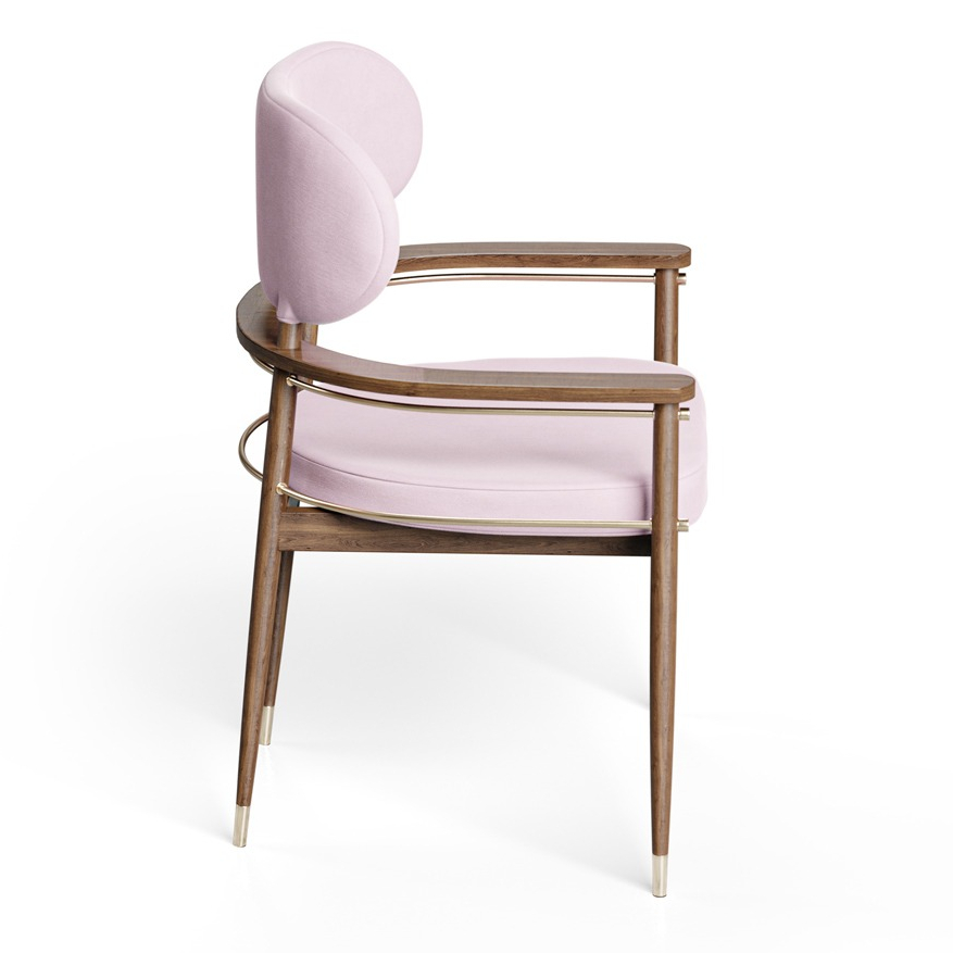 Elegant upholstered chair with wooden frame and gold accents, perfect for stylish interiors. Maison Mermont.