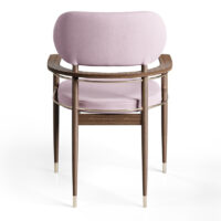 Elegant upholstered chair with wooden frame and gold accents, perfect for stylish interiors. Maison Mermont.