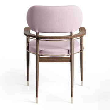 Elegant upholstered chair with wooden frame and gold accents, perfect for stylish interiors. Maison Mermont.