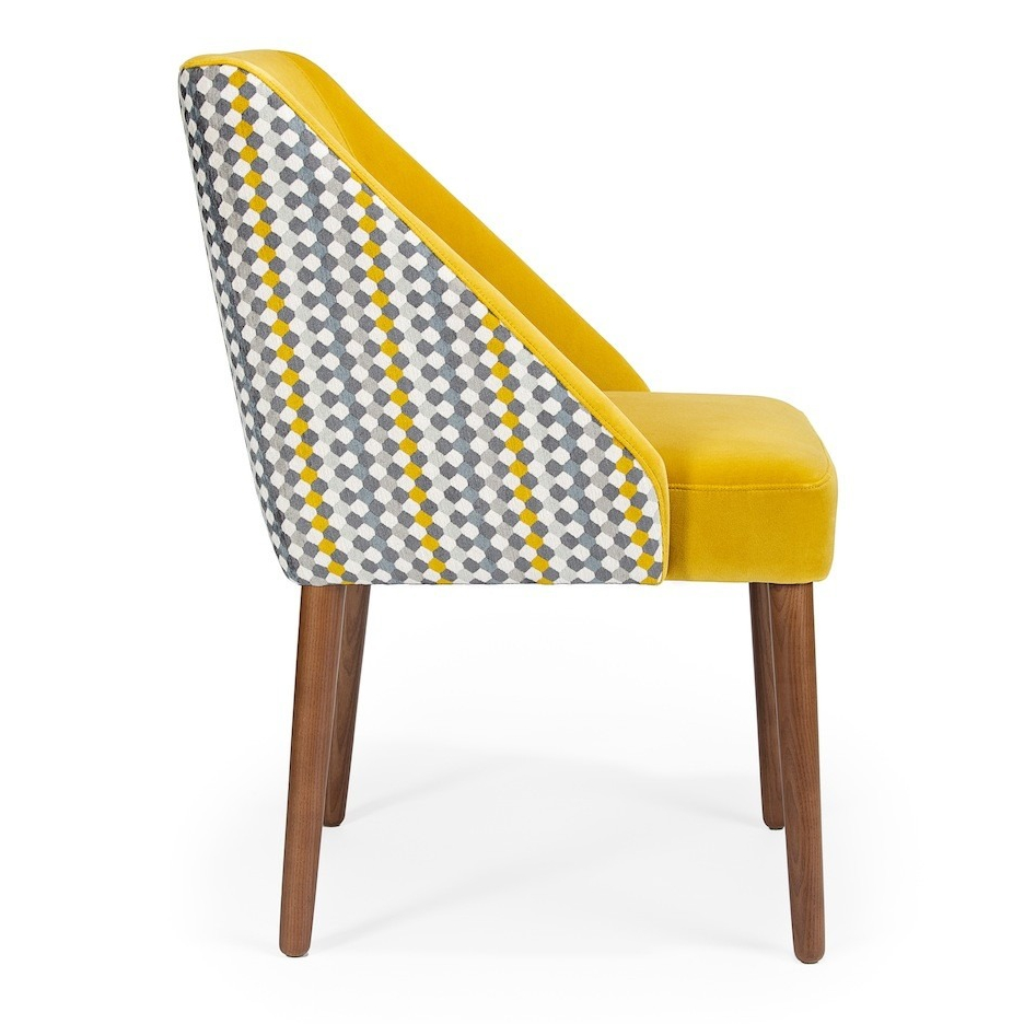 Stylish chair featuring a yellow velvet seat and a geometric patterned backrest, perfect for modern decor. Maison Mermont.