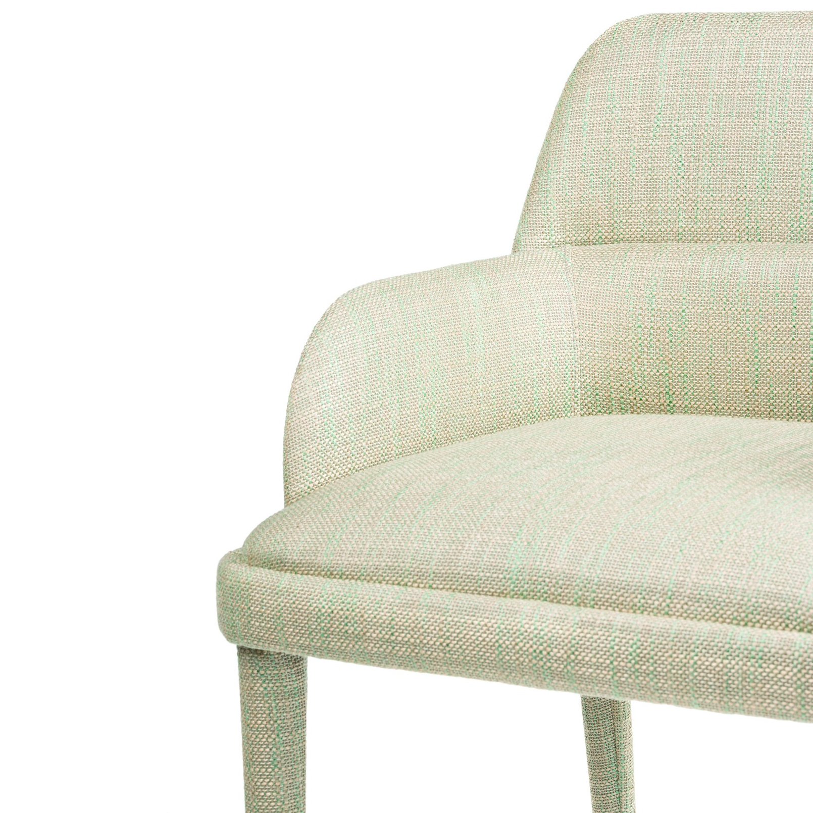 Light green upholstered chair with a modern design and curved backrest, perfect for stylish interiors. Maison Mermont.