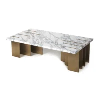Maison Mermont - Pianist Coffee Table - Calacatta Marble - Bronze Brushed Brass Elegant marble coffee table with gold accents and a modern design, perfect for stylish living spaces. Maison Mermont.