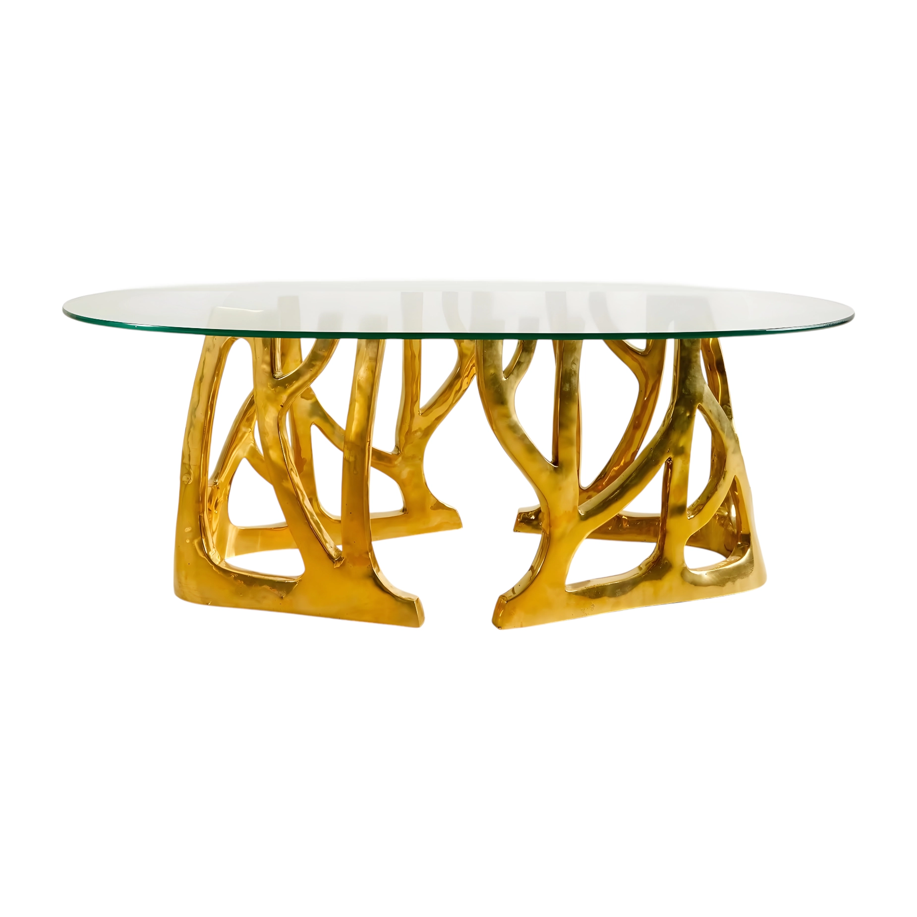 Elegant oval glass coffee table with a unique gold nature-inspired base design. Perfect for modern interiors. Maison Mermont.