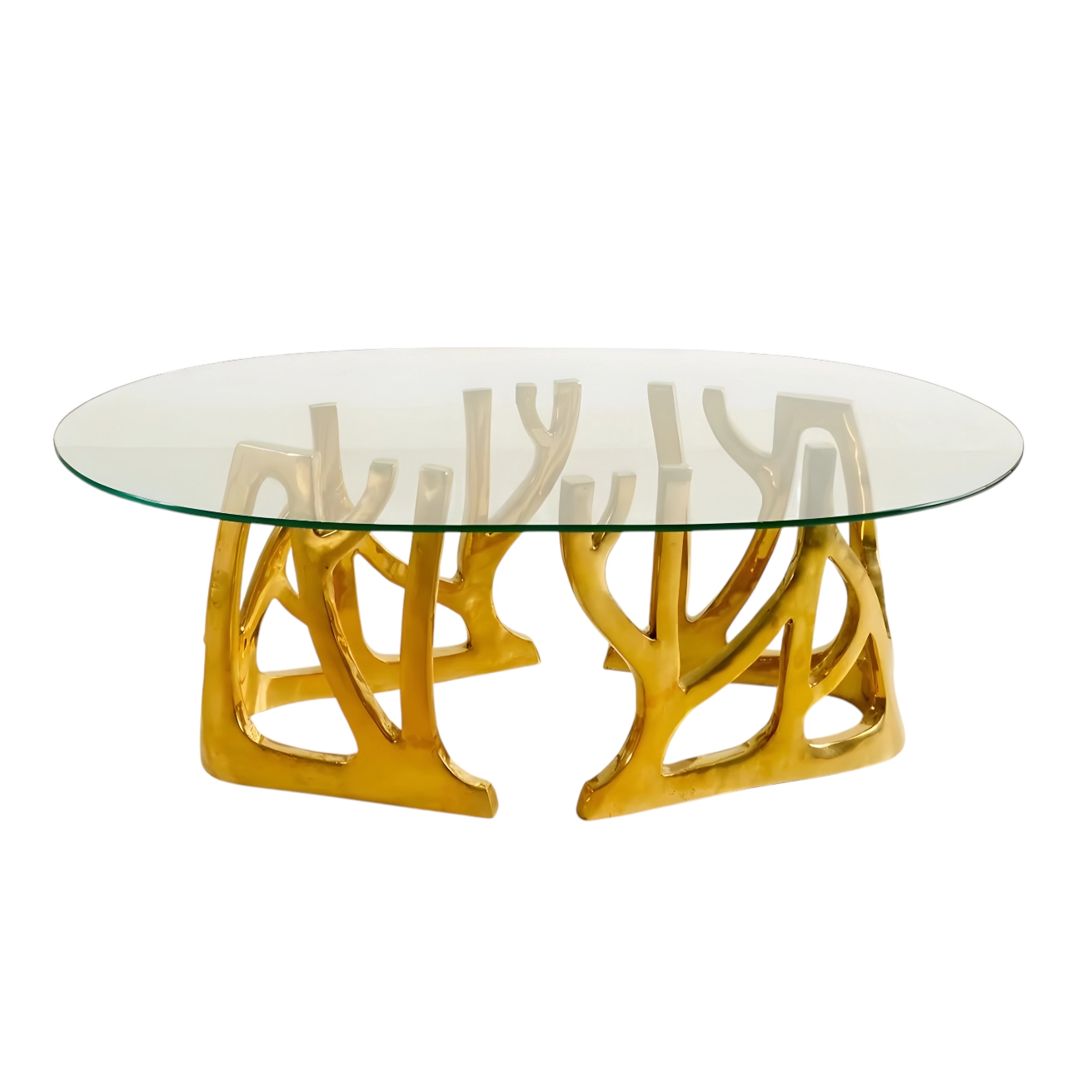 Elegant oval glass coffee table with a unique gold nature-inspired base design. Perfect for modern interiors. Maison Mermont.