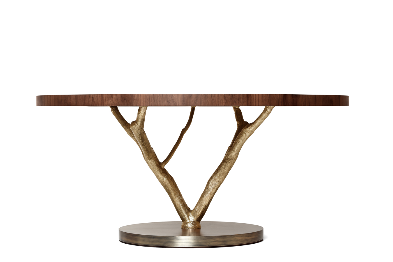 Round wooden table with elegant gold branch pedestal base. Maison Mermont.