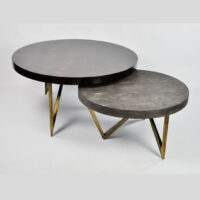 Reef Coffee Table Two round nesting coffee tables with metal legs, featuring shagreen and shell tabletops. Maison Mermont