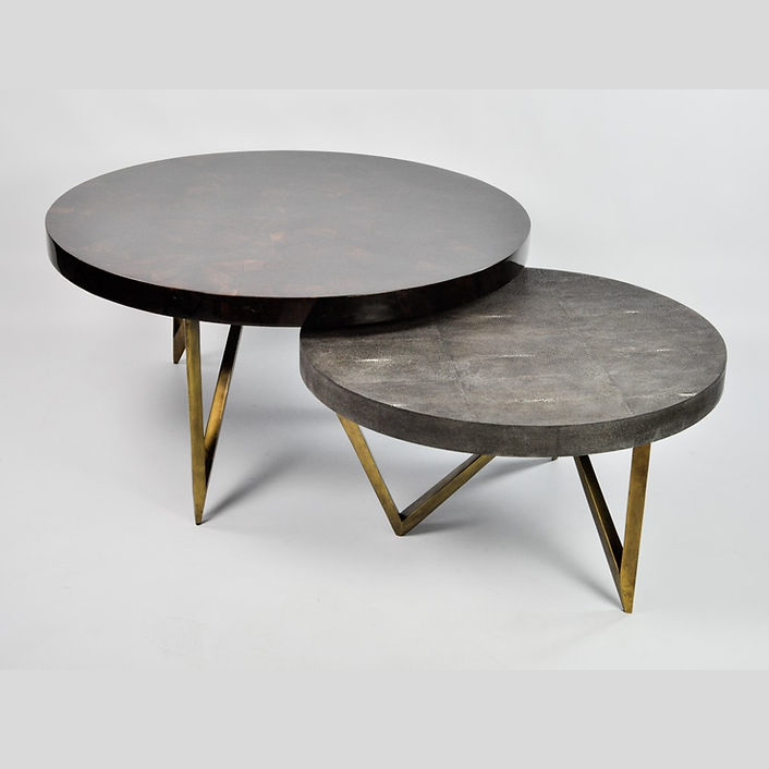 Two round nesting coffee tables with metal legs, featuring shagreen and shell tabletops. Maison Mermont